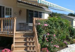 Retractable awning over a deck