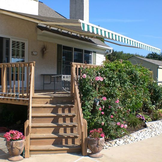 Retractable awning over a deck