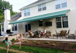 Patio with outdoor television, retractable awning, waterfall and more