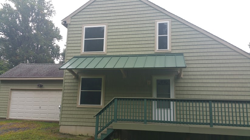 New siding, windows and metal roof transform this home