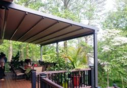 a pergola with a brown anwning