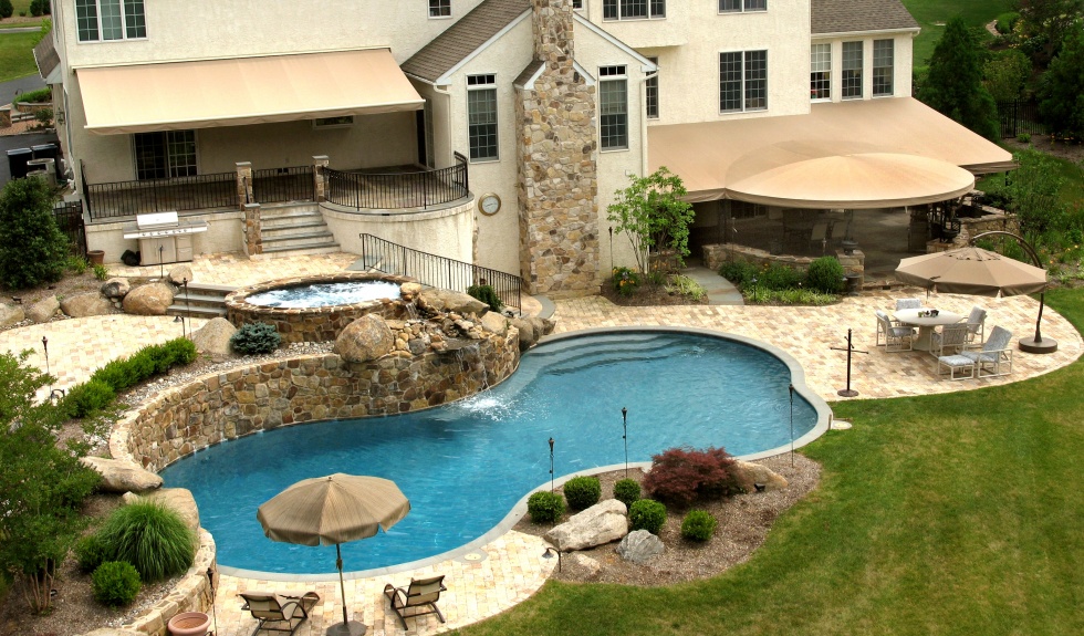 Awnings, patios, bar and grill make a perfect setting for a pool party in Chester County, PA