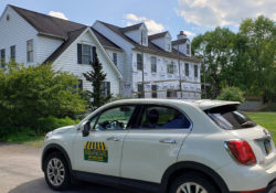 adding vinyl siding to a home after removing the moldy stone