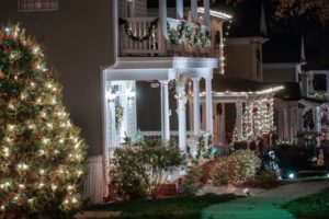 row of houses with Christmas lights