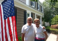 family in front of new siding