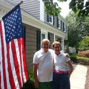 family in front of new siding