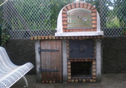 Pizzas Oven with wood storage and wood door.