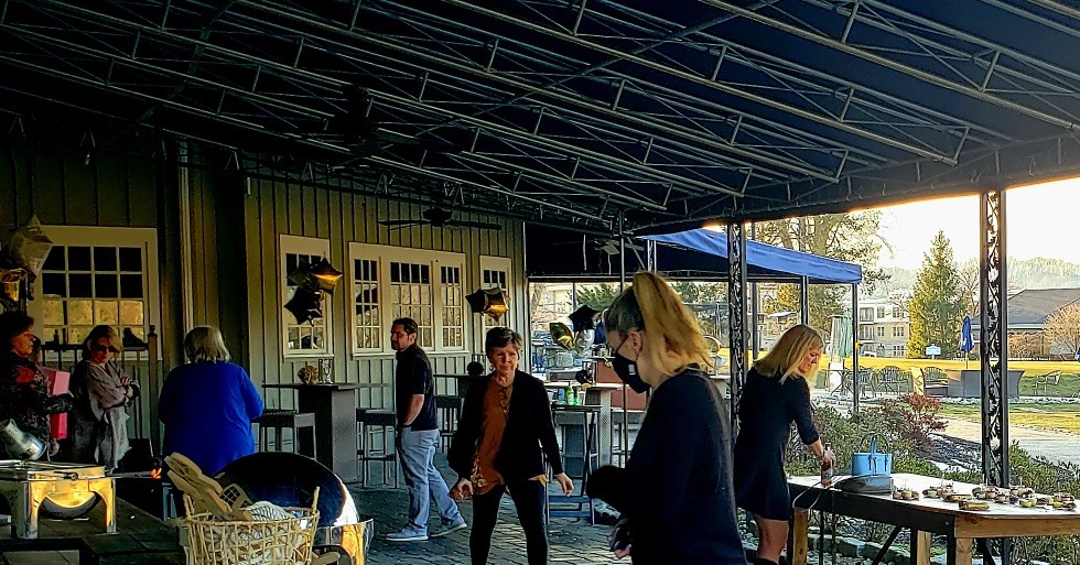 people on patio at downing town country club