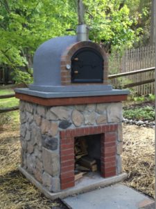Outdoor brick oven with stone