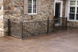 Brick patio with fence and steps