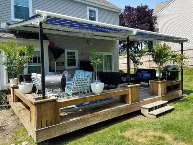 patio with sitting walls and a container garden