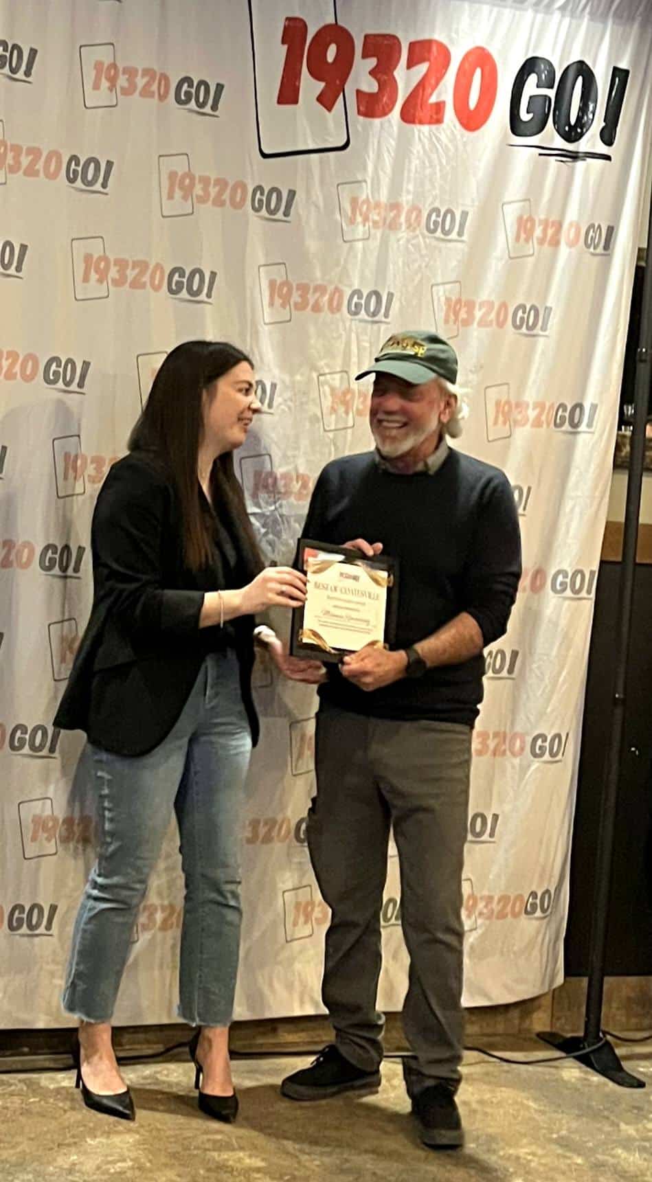 presenting award to mark