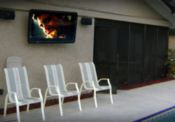 Outdoor Television on deck with seating
